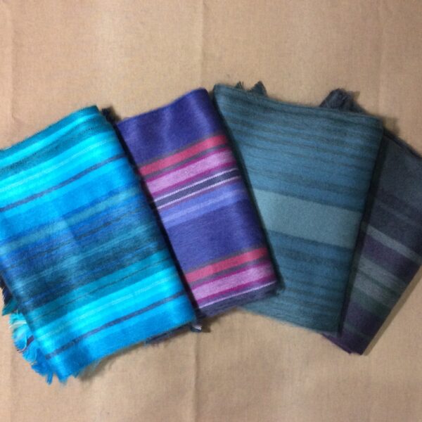 alpaca scarves folded. multi color