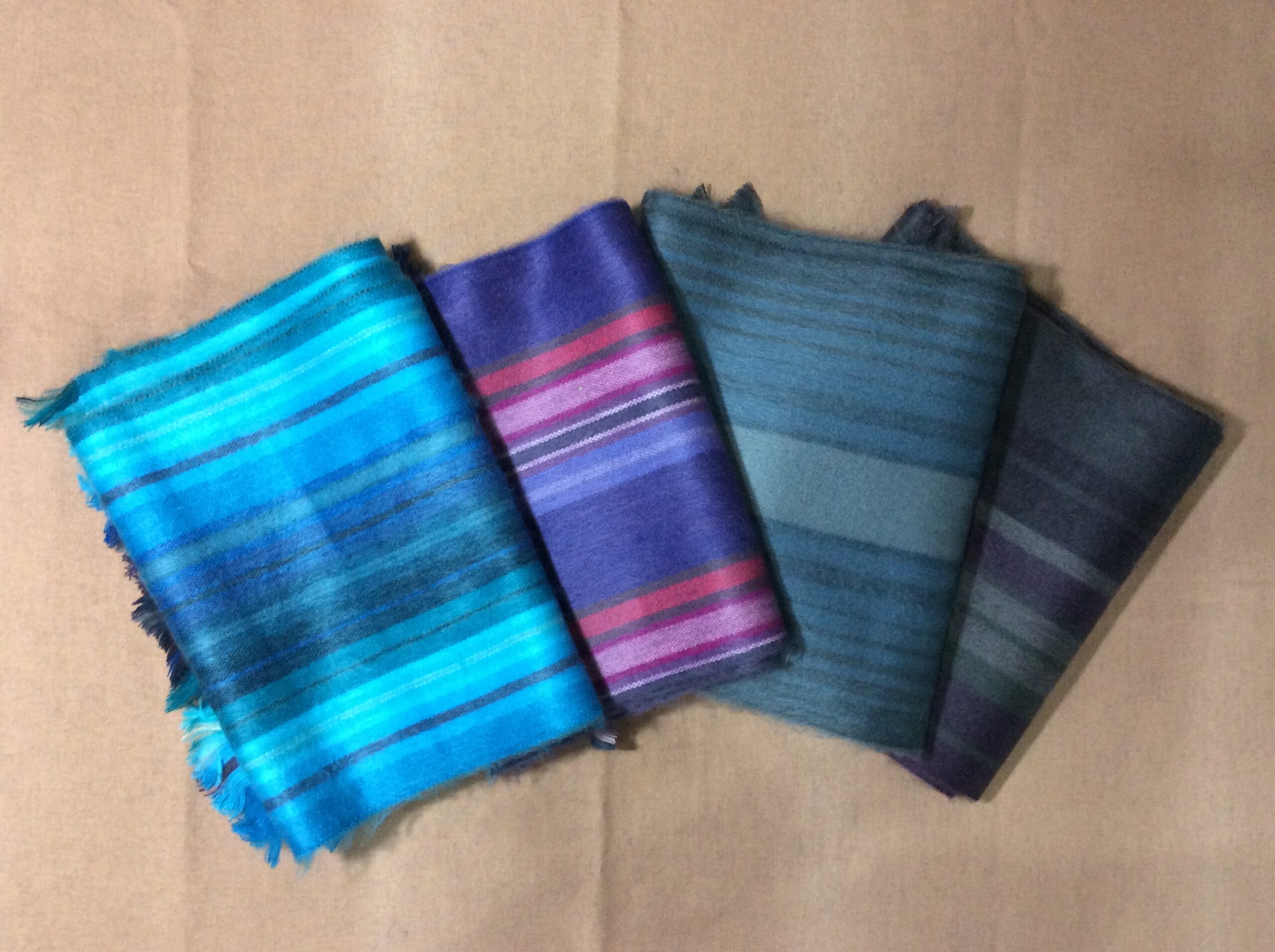 alpaca scarves folded. multi color