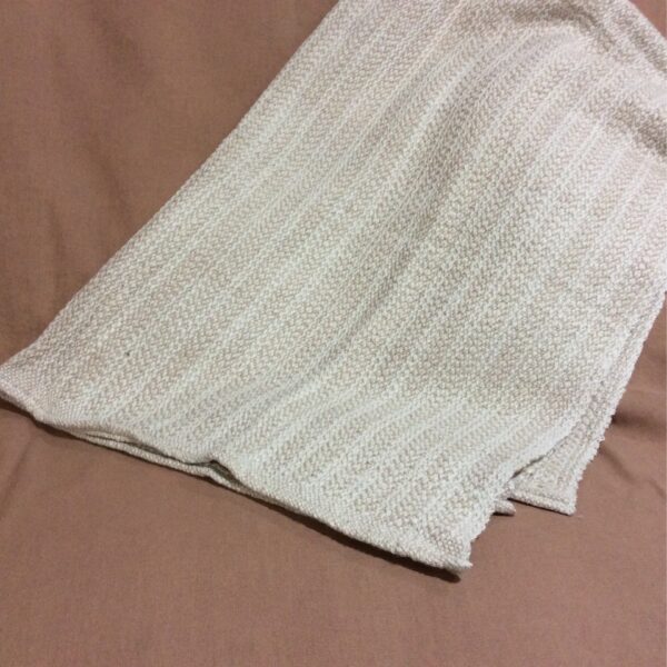 alpaca hand made blanket folded tan and white