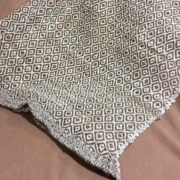 alpaca hand made blanket folded tan and white